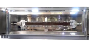 Thermo mechanical test chamber showing electrical insulator under mechanical load during temperature testing